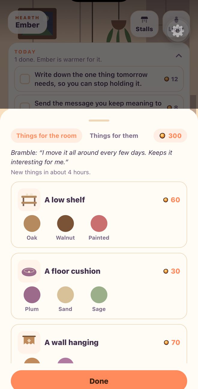 The stalls in the app: things for the room priced in warmth — a low shelf, a floor cushion, a wall hanging, each in three colourways